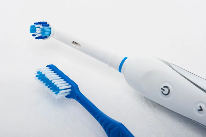 Cover for Electric Toothbrushes Versus Manual Brushing
