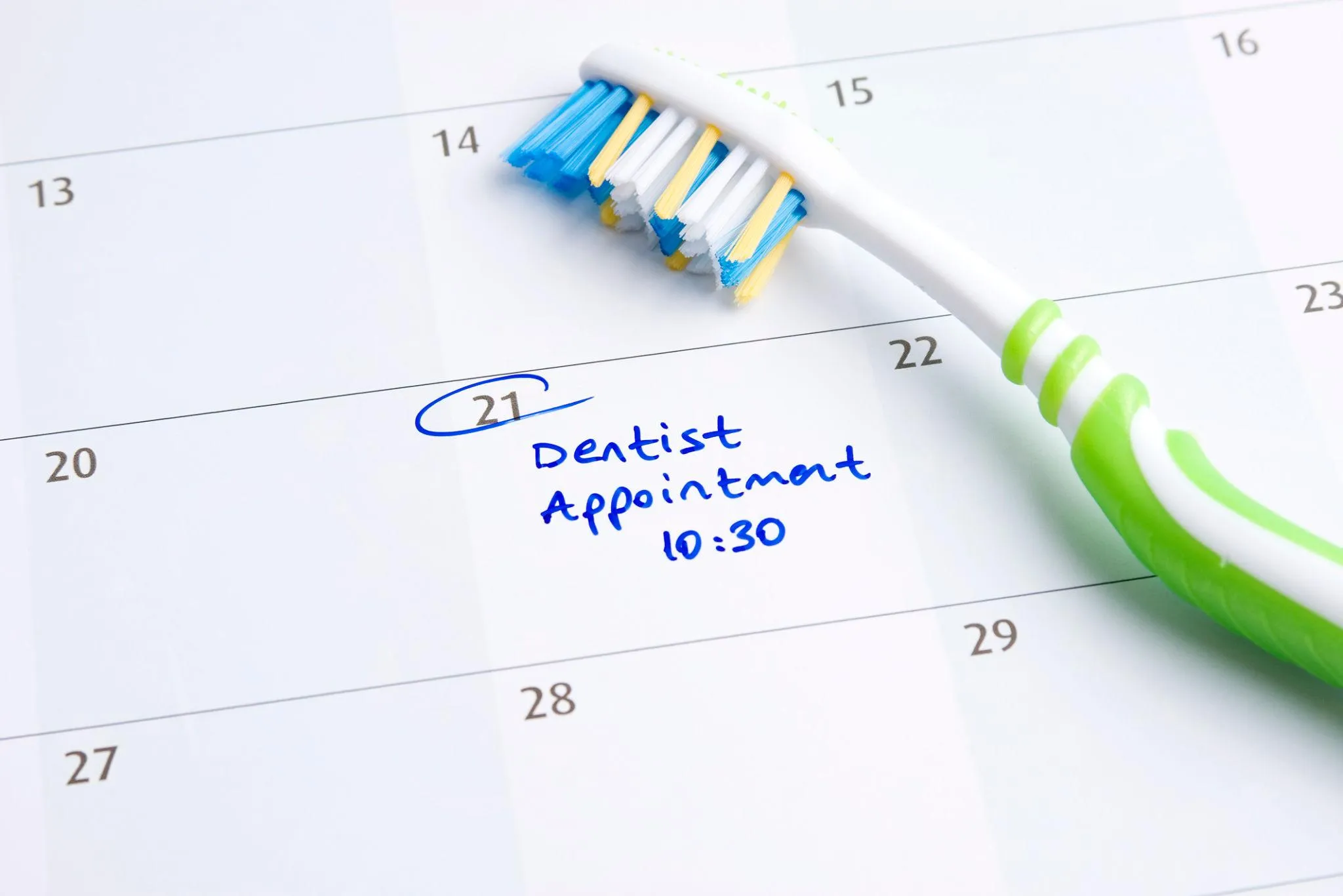 Calendar marked with a family dental visit reminder